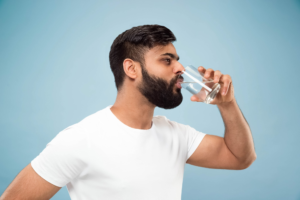 man drinking water 