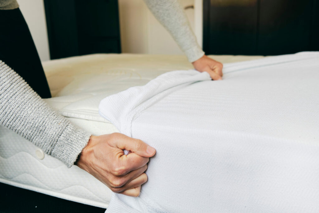 Mattress protector on bed representation image